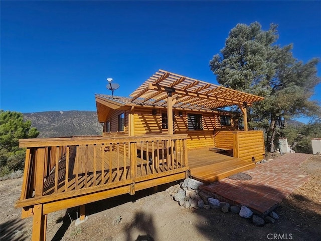 wooden deck featuring a pergola