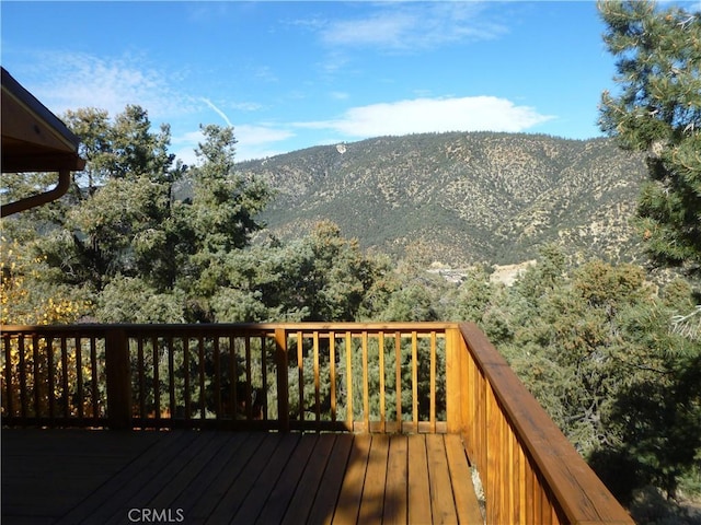 wooden deck featuring a mountain view