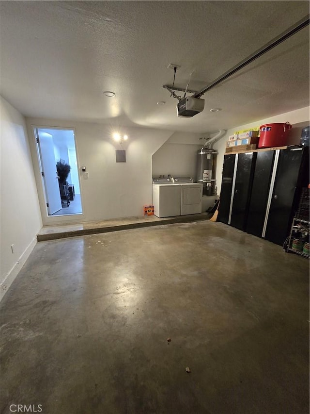 garage with a garage door opener, gas water heater, and independent washer and dryer