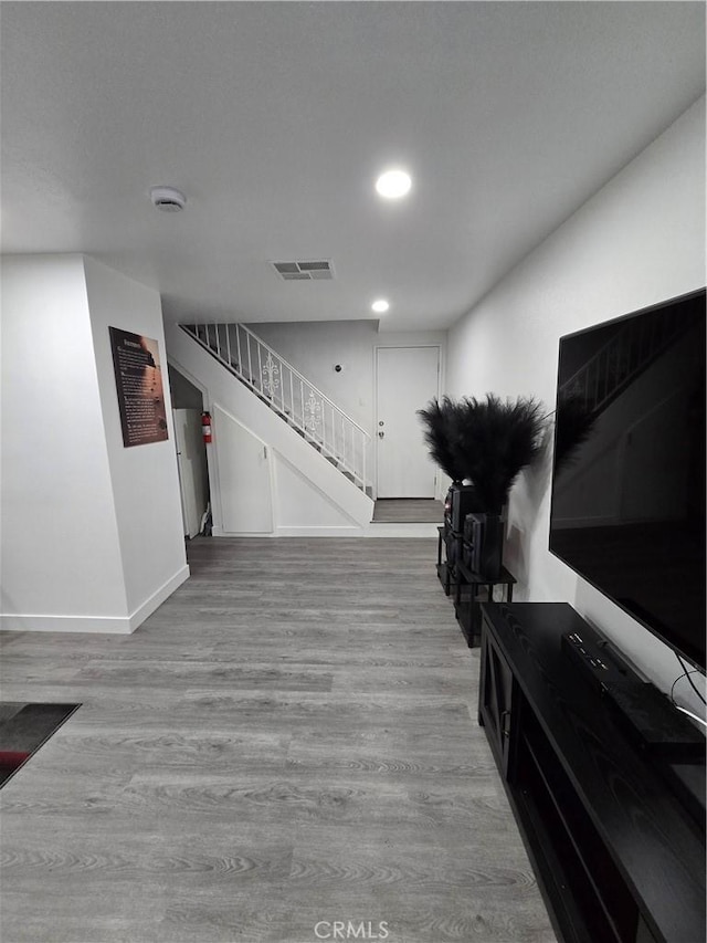 20983 E Covina Blvd Unit J, Covina, CA 91724 - living room featuring stairway, light wood finished floors, baseboards, and recessed lighting