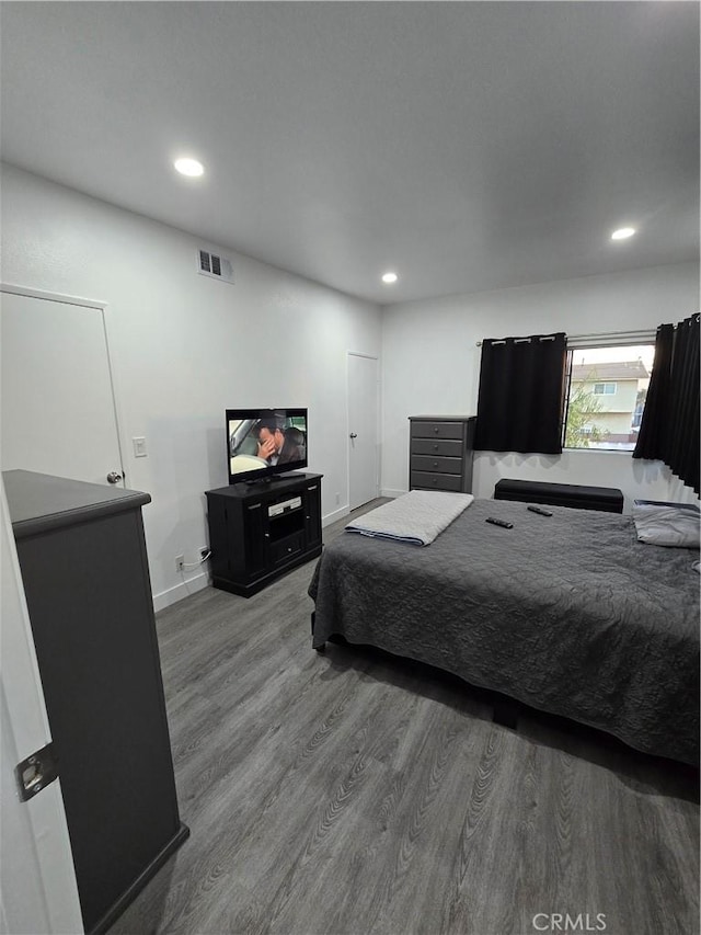 bedroom with wood-type flooring