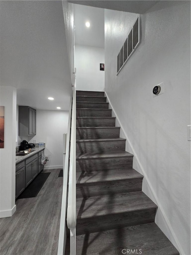 20983 E Covina Blvd Unit J, Covina, CA 91724 - staircase with wood finished floors, baseboards, and recessed lighting