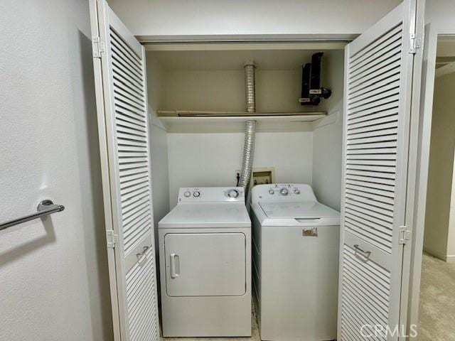 washroom with washer and clothes dryer