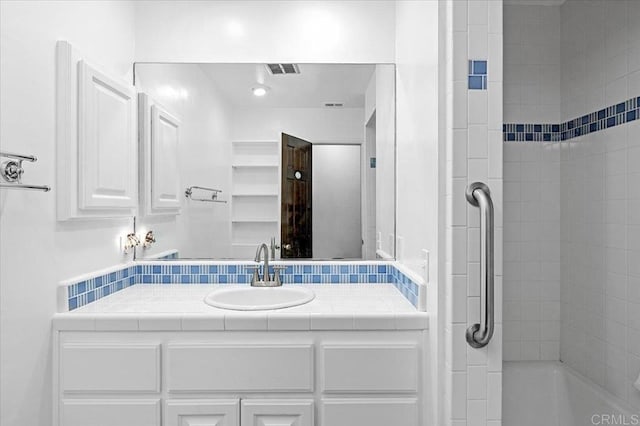 bathroom featuring vanity and visible vents