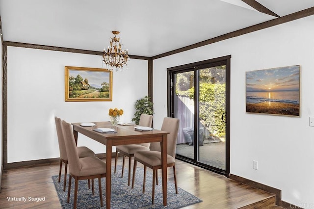 dining space with baseboards, a chandelier, and dark wood-style flooring