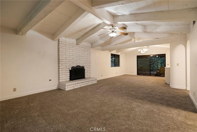 unfurnished living room with ceiling fan with notable chandelier, vaulted ceiling with beams, carpet flooring, and a fireplace