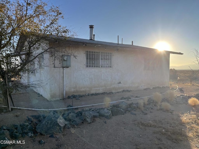 view of property exterior at dusk