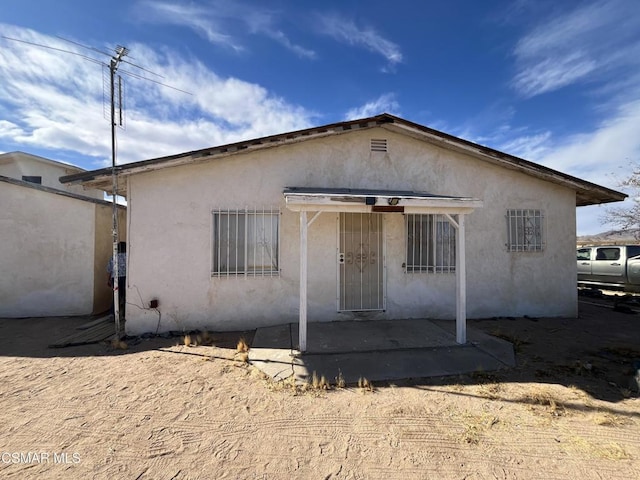 view of front of property with a patio area