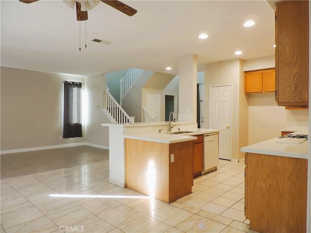 kitchen with ceiling fan, sink, white appliances, a kitchen island with sink, and light tile patterned floors