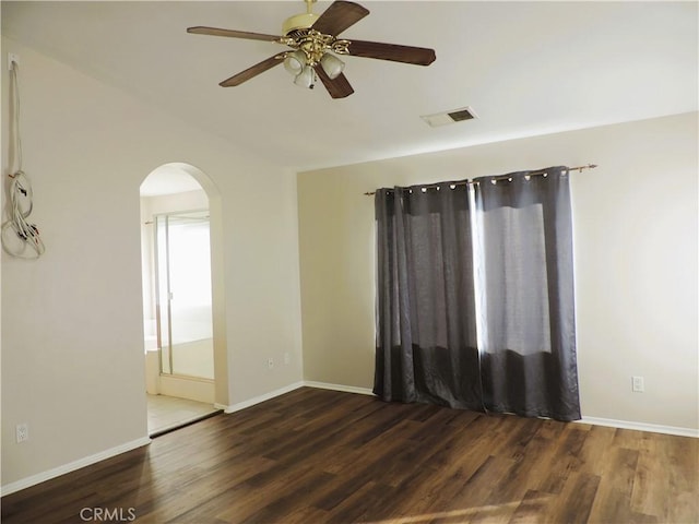 empty room featuring dark hardwood / wood-style floors and ceiling fan