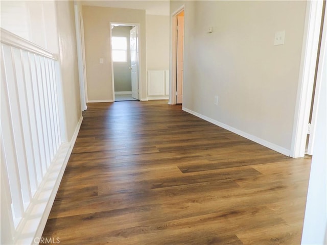 empty room featuring dark wood-type flooring