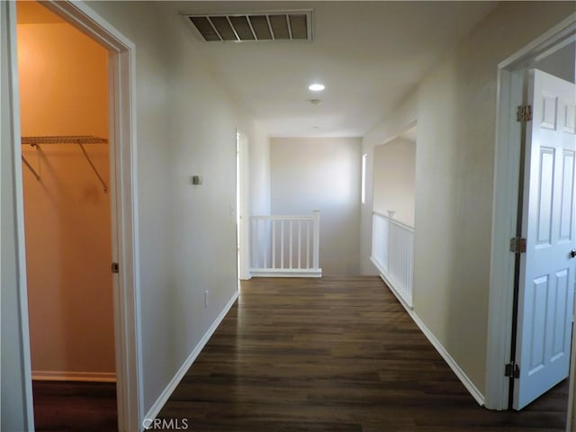 hall with dark hardwood / wood-style flooring