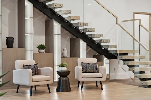 staircase featuring wood-type flooring