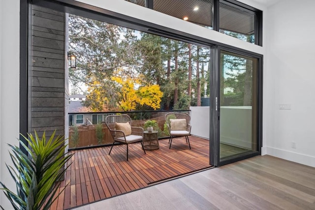 entryway with hardwood / wood-style floors