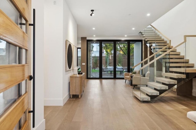 entrance foyer featuring light hardwood / wood-style flooring