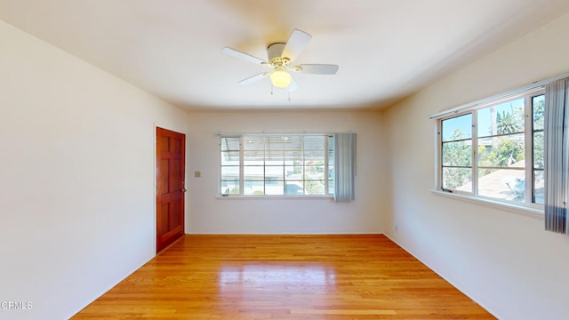 spare room with ceiling fan and light hardwood / wood-style flooring