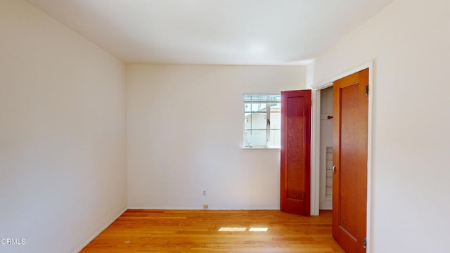 spare room featuring light hardwood / wood-style flooring