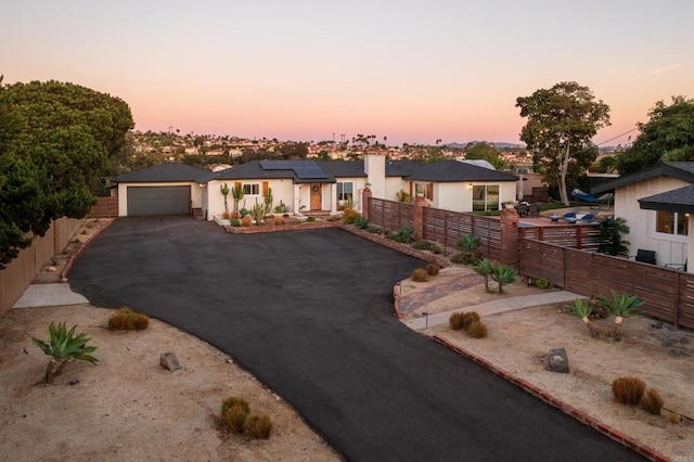 view of front of home featuring solar panels