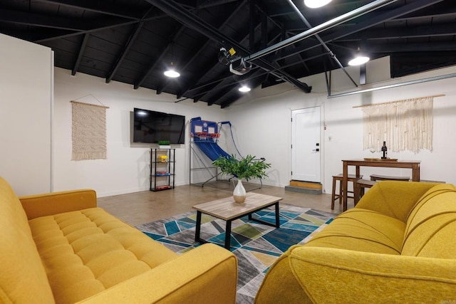 living room with vaulted ceiling with beams