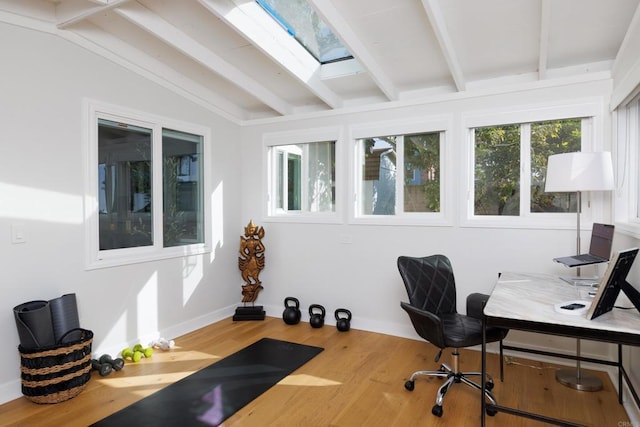 office with hardwood / wood-style floors and vaulted ceiling with beams