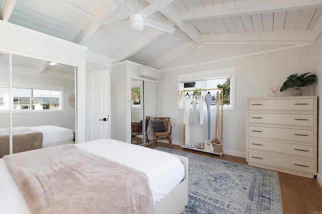 bedroom featuring a wall mounted AC, ceiling fan, hardwood / wood-style flooring, wooden ceiling, and vaulted ceiling with beams