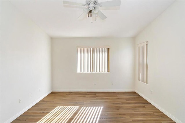 unfurnished room featuring hardwood / wood-style floors and ceiling fan