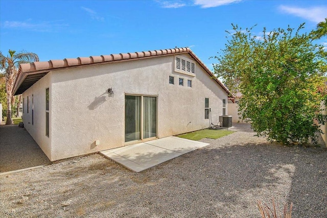 back of house with a patio area and cooling unit