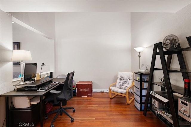 home office featuring hardwood / wood-style floors