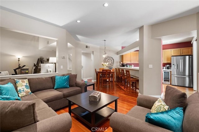 living room with light wood-type flooring and wine cooler