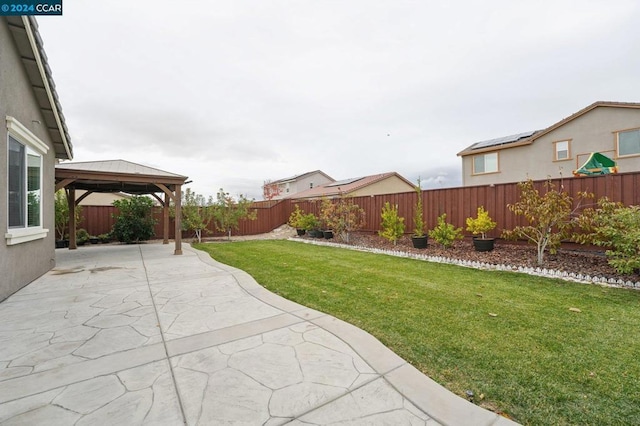 view of yard featuring a gazebo and a patio