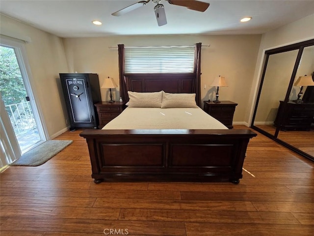 bedroom featuring hardwood / wood-style flooring and ceiling fan