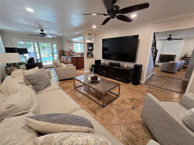 living room with a fireplace and ornamental molding