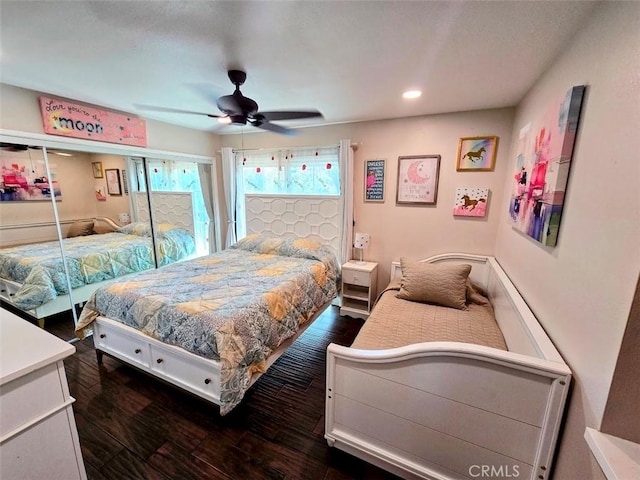 bedroom featuring ceiling fan and dark wood-type flooring