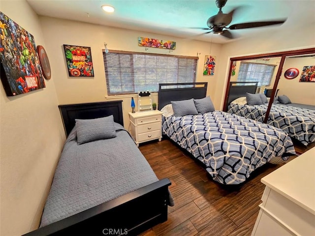 bedroom featuring ceiling fan and dark wood-type flooring