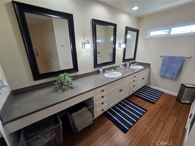 bathroom featuring wood-type flooring and vanity