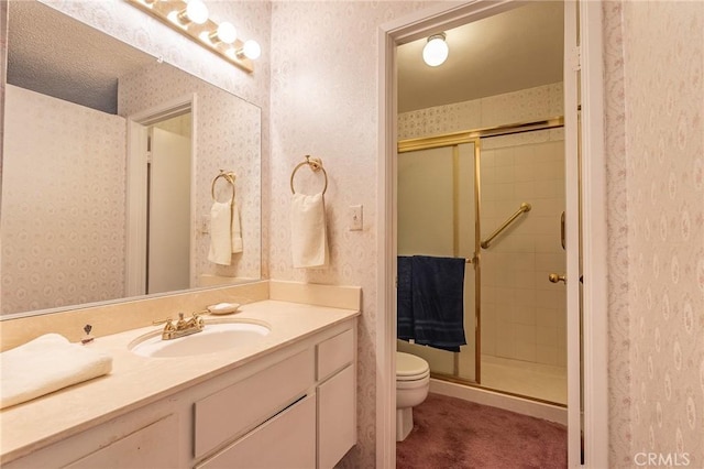 bathroom with walk in shower, vanity, and toilet