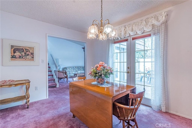 carpeted dining room with french doors, a textured ceiling, and a notable chandelier