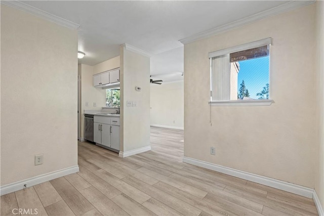 interior space with light hardwood / wood-style floors, ceiling fan, crown molding, and sink