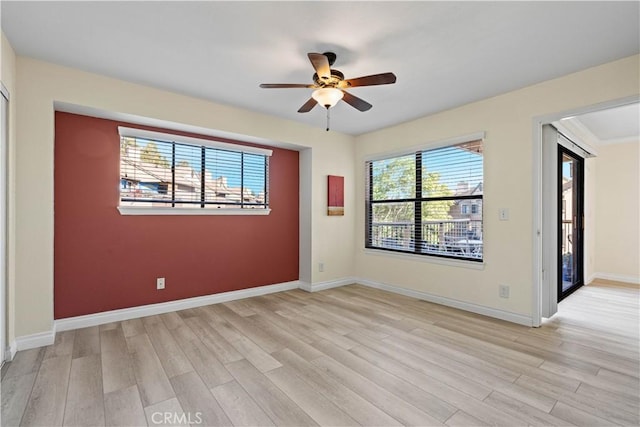 unfurnished room featuring ceiling fan and light wood-type flooring