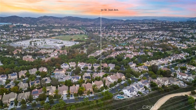 aerial view at dusk with a mountain view