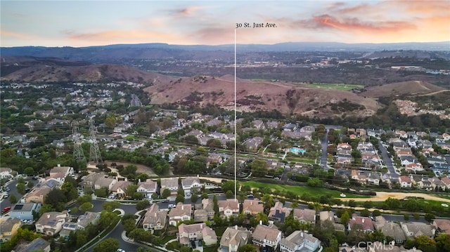 aerial view at dusk with a mountain view