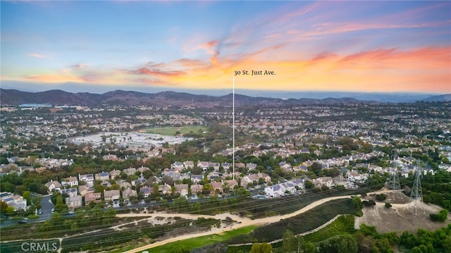 aerial view at dusk with a mountain view