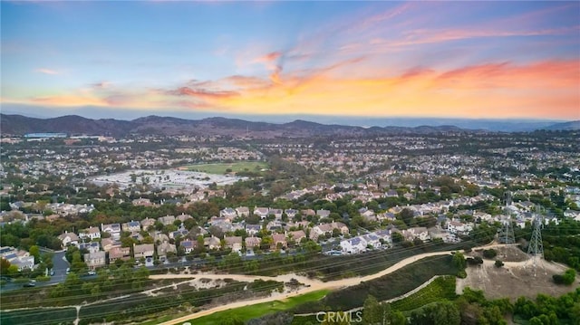 aerial view at dusk with a mountain view