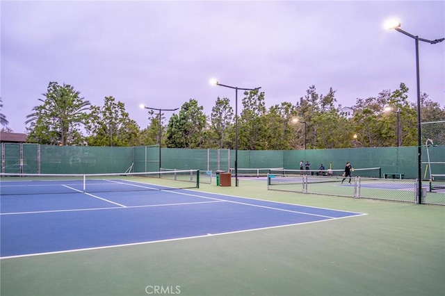 view of tennis court featuring basketball court