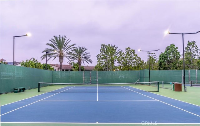 view of sport court featuring basketball hoop