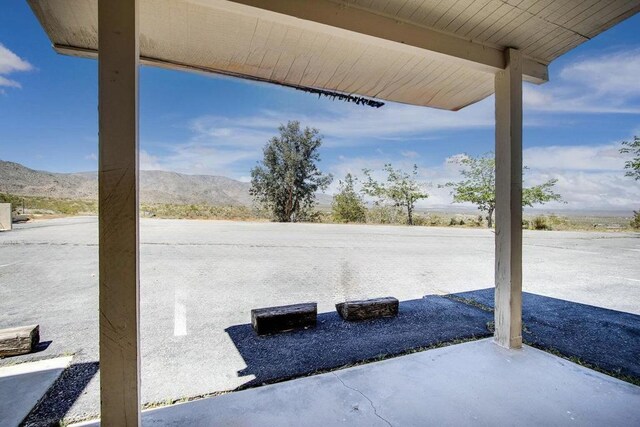 view of patio / terrace with a mountain view