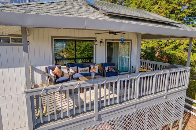 wooden deck featuring an outdoor hangout area and ceiling fan