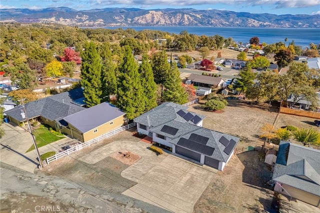 birds eye view of property featuring a water and mountain view