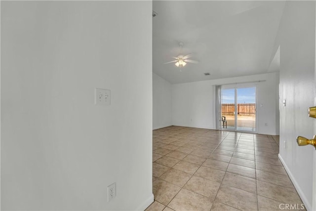 spare room with light tile patterned floors and ceiling fan