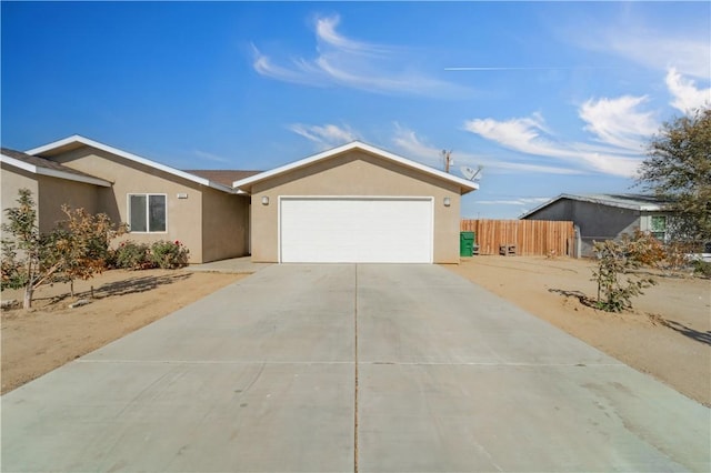 ranch-style home featuring a garage